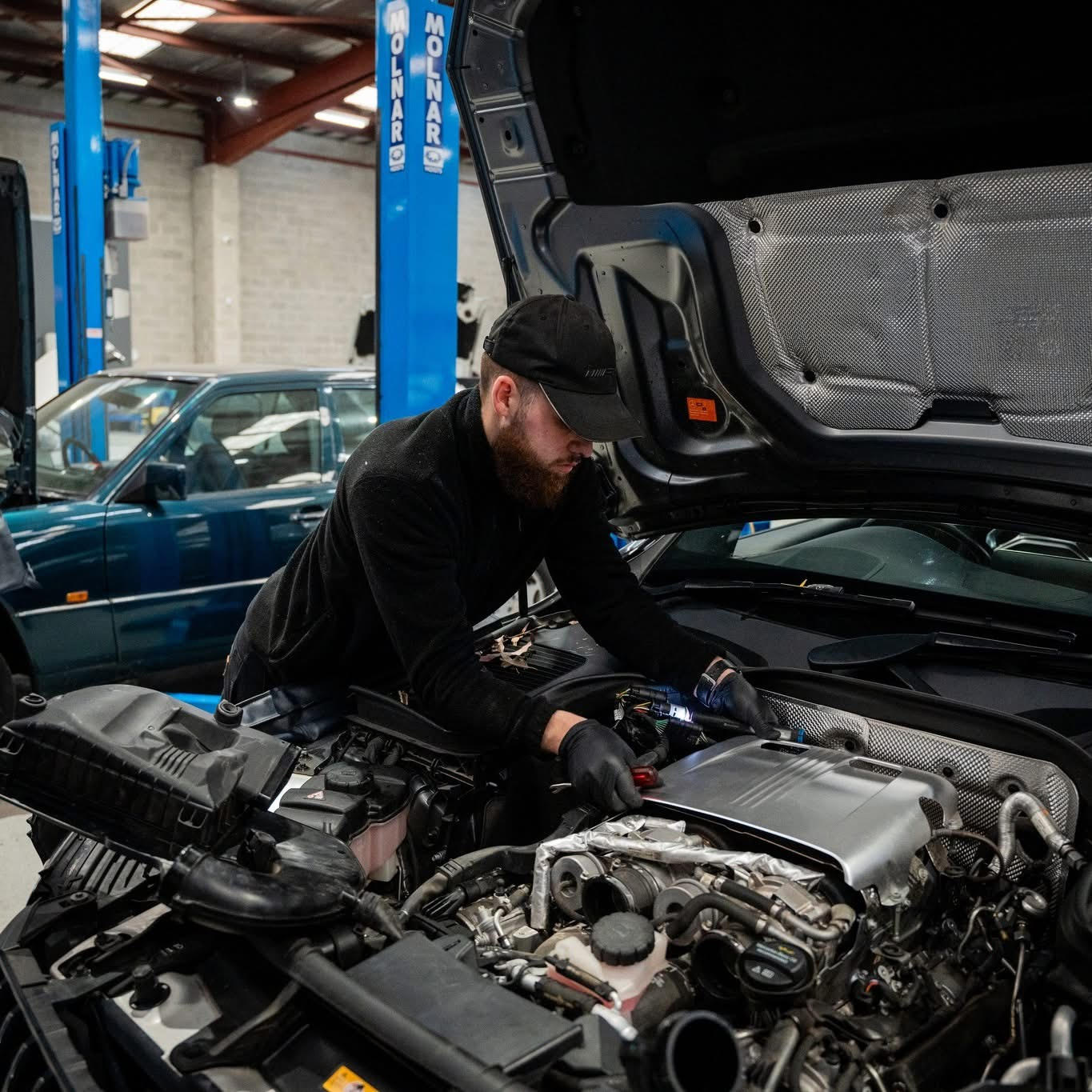 Ricky working on a Mercedes engine at the HazTech Autoworks workshop